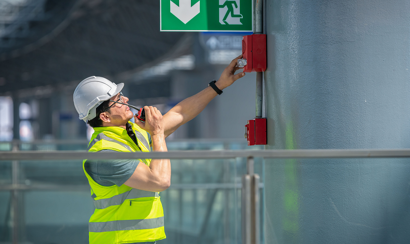 FrontLine technician inspecting fire alarm equipment
